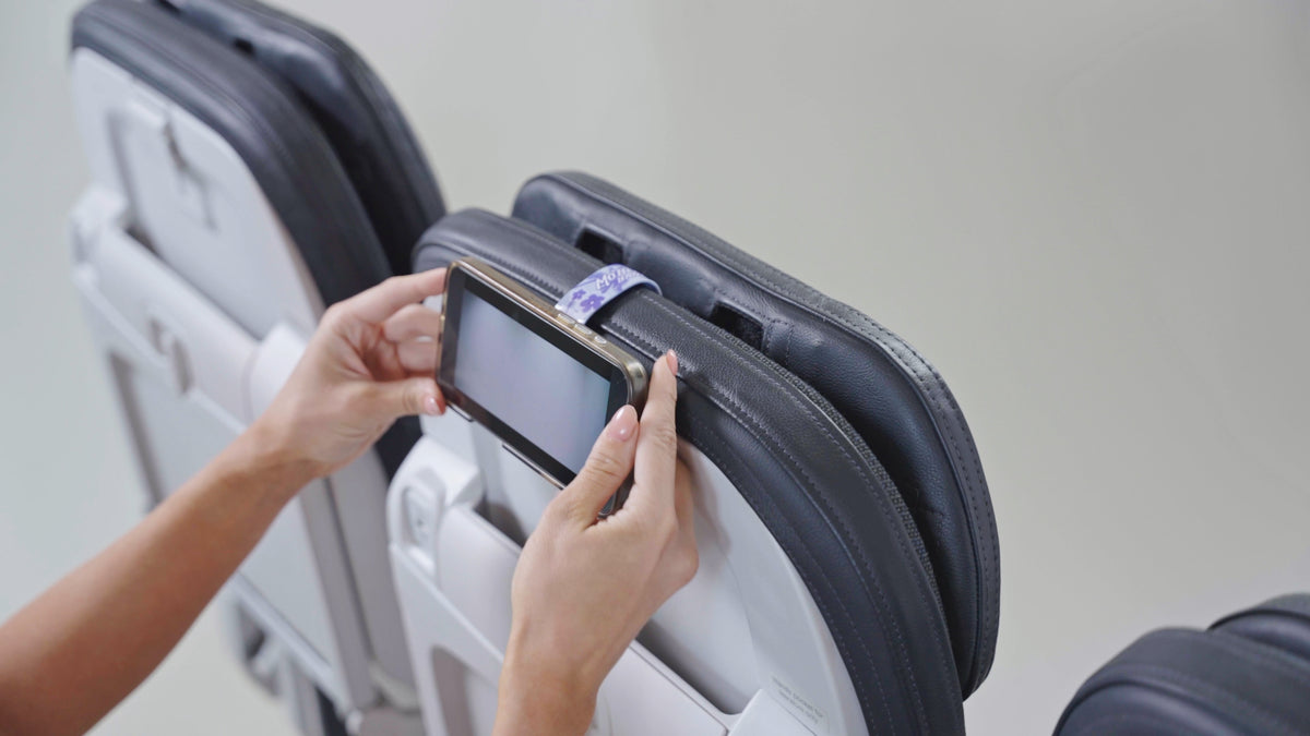 Mo'Bettah MagSafe® phone holder on airplane headrest