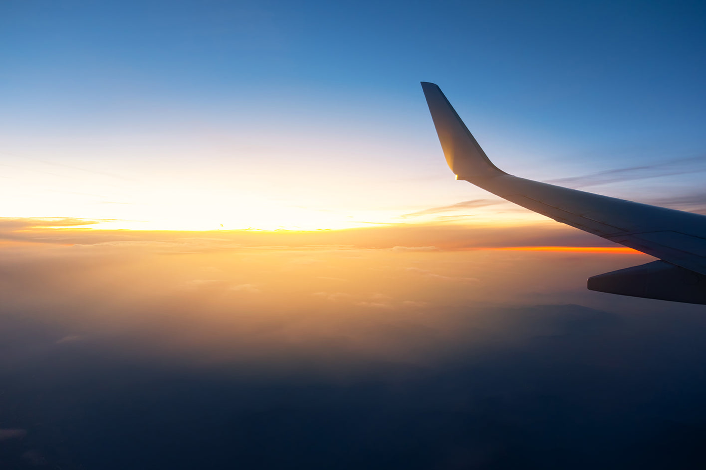 Aerial view from airplane window — travel with Mo'Bettah Bands MagSafe phone holder